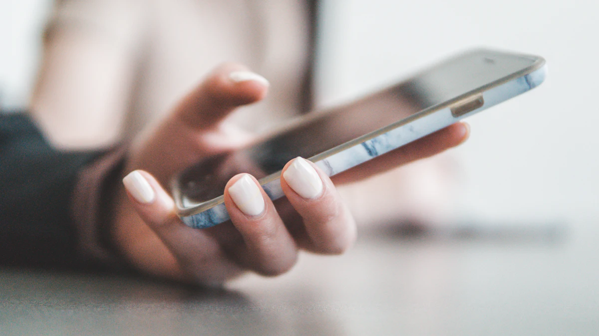 Hand holding a smartphone, ready to leave a review